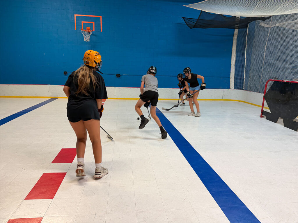 Player skating on the dryland training surface at Build Your Game