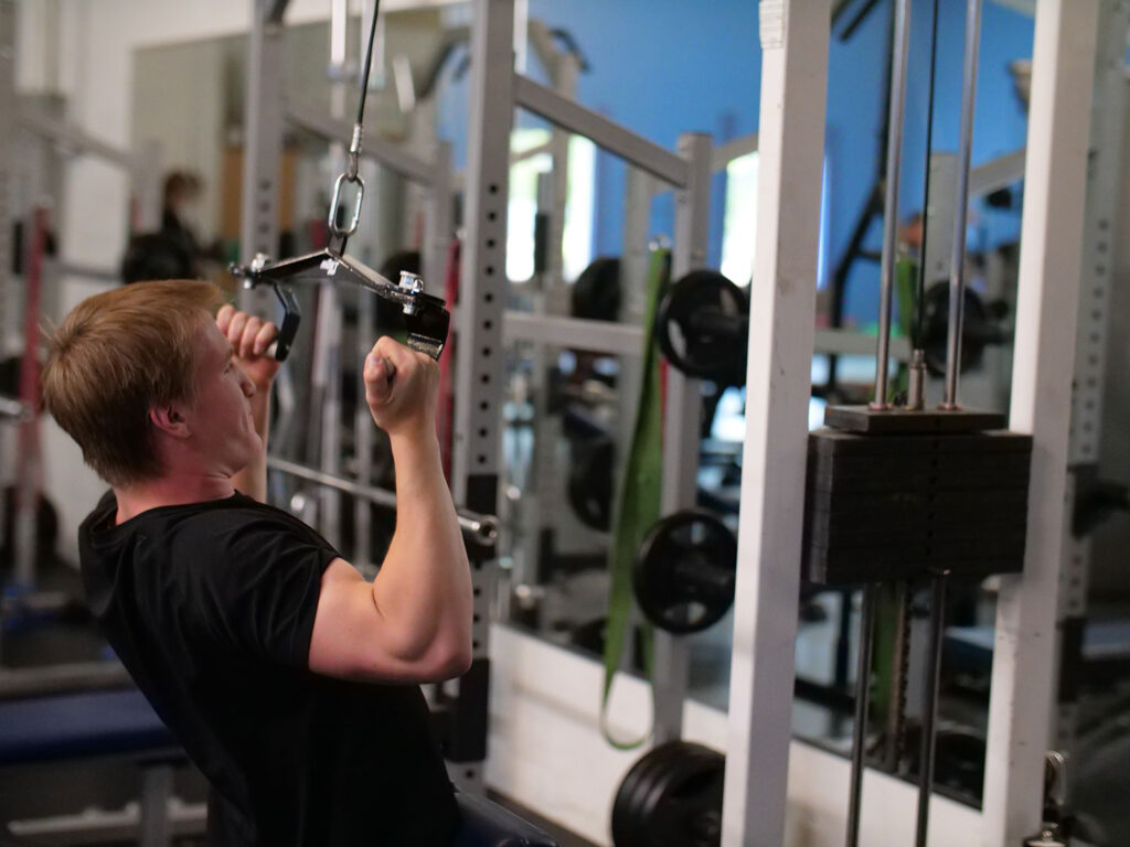 Strength training equipment in the Build Your Game weight room